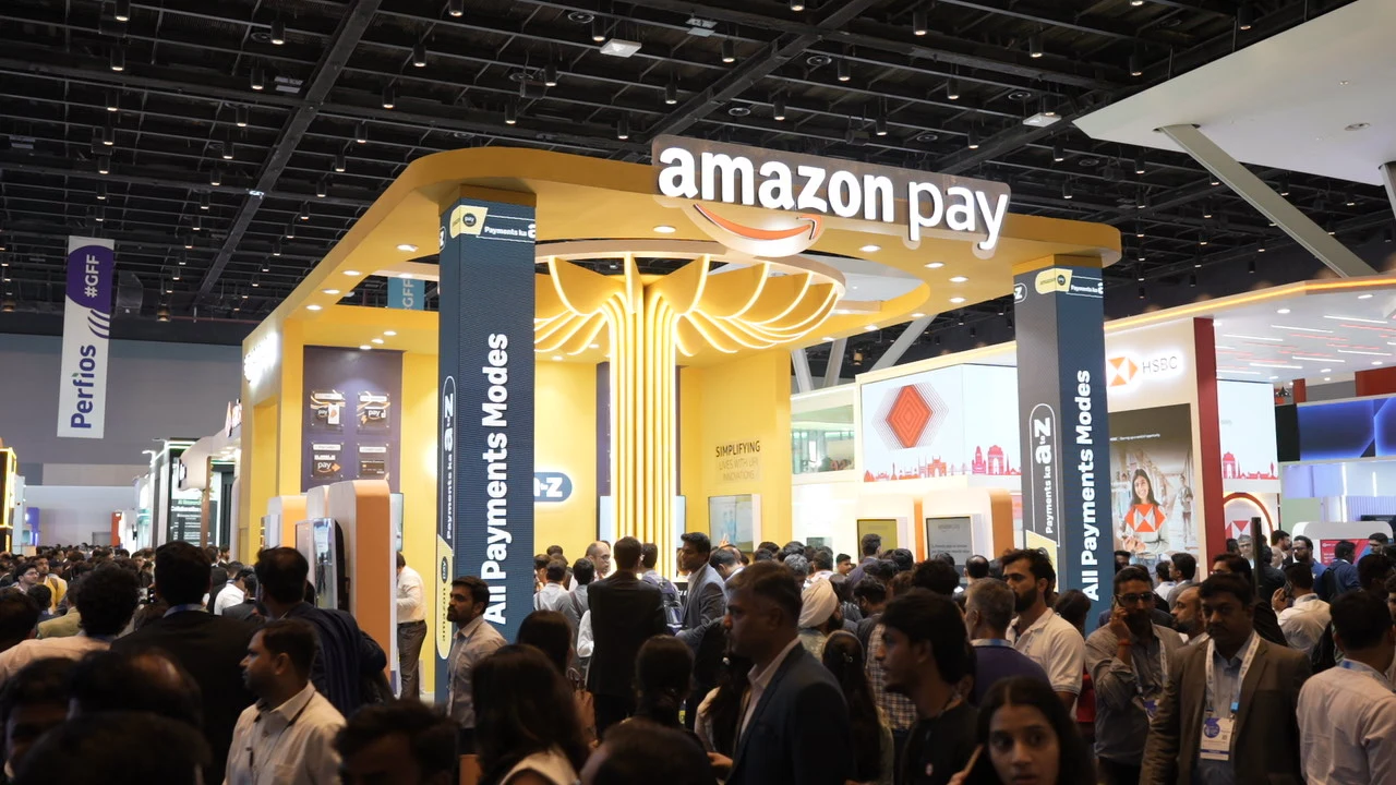 Amazon Pay exhibition stand with attendees gathered around it